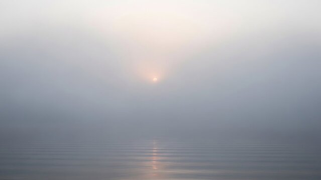 Abstract seascape captured under a veil of ethereal mist, sun's muted glow reflected upon calm water