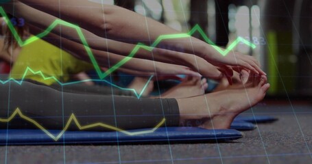 Stretching three women in leggings reaching toes on blue gym mats with data overlay, yellow top