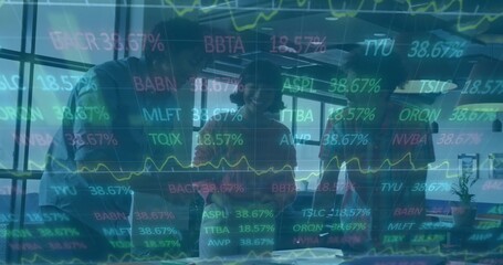 Leaning three colleagues in business attire reviewing documents on table at office, with tickers