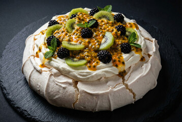 Snow-Peaked Island Pavlova Cake with Passion Fruit Kiwi and Blackberries