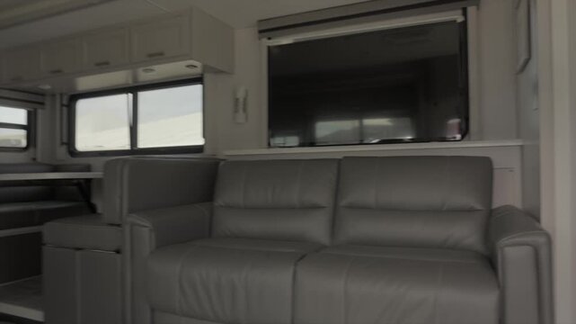 This video shows a POV perspective of someone walking into a RV camper van.