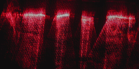 Dark red silk or satin fabric texture with dramatic lighting and shadow effects