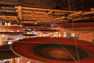 Wat Hualamphong, a royal Buddhist temple with ornate details and a colorful, chandelier lit hall in Bangkok, Thailand