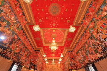 Wat Hualamphong, a royal Buddhist temple with ornate details and a colorful, chandelier lit hall in Bangkok, Thailand