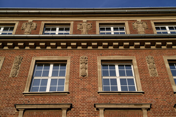 Obraz premium Detail of the red brick architecture of the former ThyssenKrupp administrative building in Ehrenfeld, Cologne, featuring neoclassical ornaments