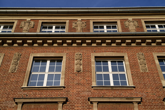 Detail of the red brick architecture of the former ThyssenKrupp administrative building in Ehrenfeld, Cologne, featuring neoclassical ornaments - Powered by Adobe