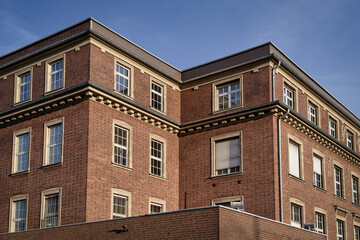Fototapeta premium Detail of the red brick architecture of the former ThyssenKrupp administrative building in Ehrenfeld, Cologne, featuring neoclassical ornaments