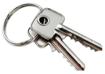 Two small, silver, simple keys hanging from a circular silver keyring