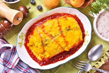 Japanese omelet rice on white plate.