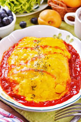 Japanese omelet rice on white plate.