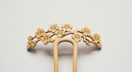 Elegant natural wood hairpin artfully carved with exquisite blossoms beautifully displayed under soft gentle light. AI Generated