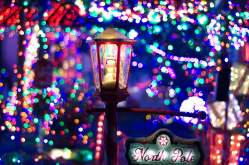 North Pole Snowman in Street Lamp with Christmas Lights.