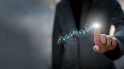 Businessman analyzing stock market data with digital candlestick chart, investment and opportunity concept, trading strategy, financial growth, business and enterprise analysis.