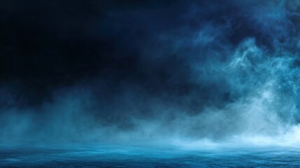Fototapeta premium A dark, misty landscape with swirling blue fog, creating a mysterious and atmospheric scene.