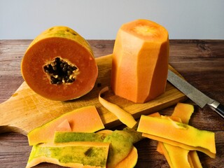cut and peeled papaya on table © Jacky