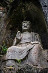 Obraz premium Hangzhou, China, Buddha sculpted inside a rock, fei lai feng