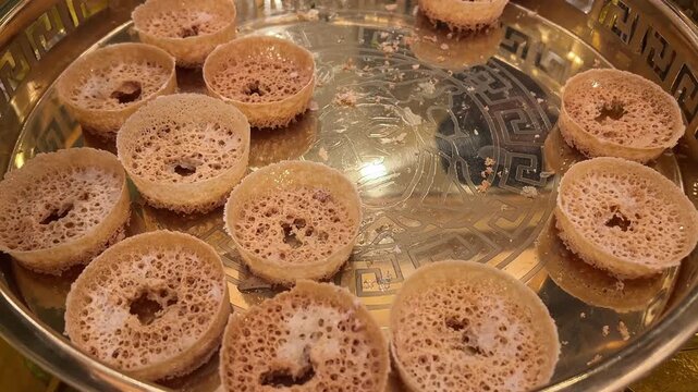 Ghevar or ghewar is a disc-shaped Rajasthani sweet with a honeycomb-like texture, made from ghee