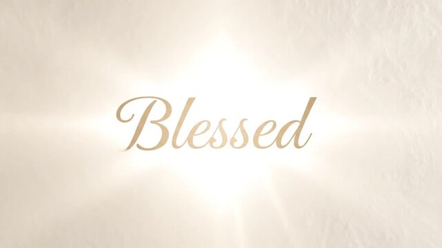 Blessed gold text on beige background with light.