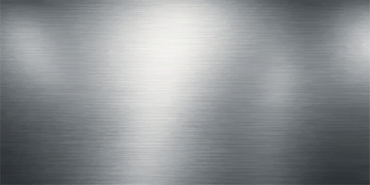 A polished silver stainless steel plate features a brushed metal texture with a shiny industrial gray pattern reflecting light across the metallic titanium and aluminum surface material