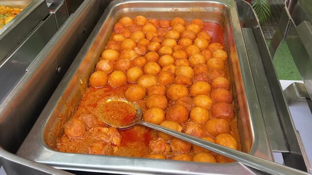 Round-shaped malai kofta served at an Indian wedding in Kolkata