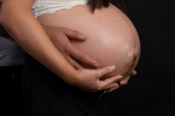 Pregnant woman big belly final weeks of pregnancy gender reveal