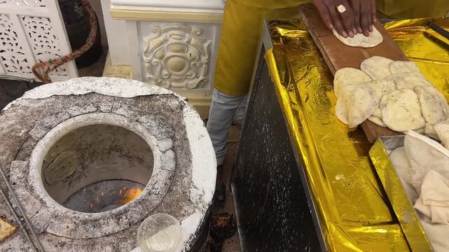 Making live tandoori roti in an Indian wedding