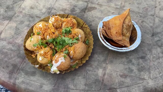 Indian-style dahi puchka and samosa prepared with spices 
