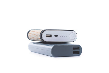 Two portable power banks stacked together with USB ports and indicators. Modern gadgets representing mobile charging solutions and backup battery options for devices.
