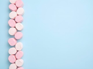 Pastel Pink and White Marshmallows on Blue Background