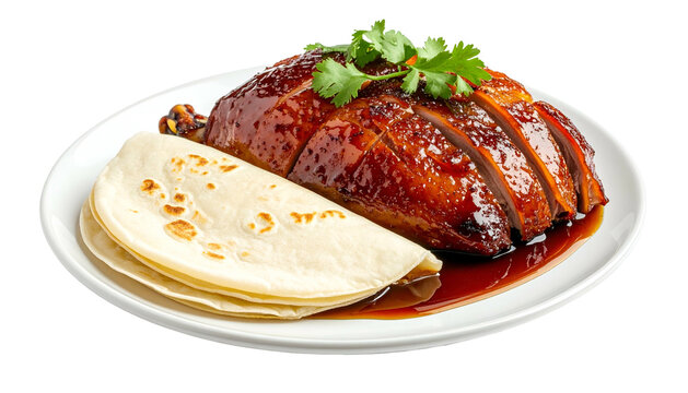 Sliced, glazed roast poultry with pancakes and garnish on white plate, shot against transparency
