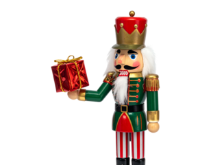 A wooden toy soldier with a mustache, presenting a red gift box