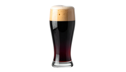 A tall glass filled with dark, frothy beer against a black background