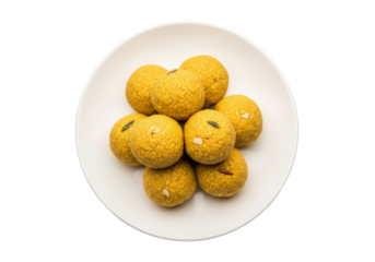 besan laddoo platter on white plate, golden indian sweets
