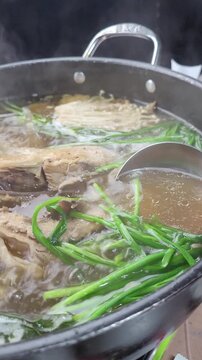 Korean Traditional Health Food Nurungji Baeksuk, Boiled Chicken with Scorched Rice Sizzling in a Pot
