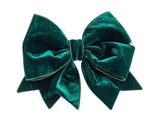 A close-up of a large, luxurious, emerald-green velvet bow with gold trim on a black background