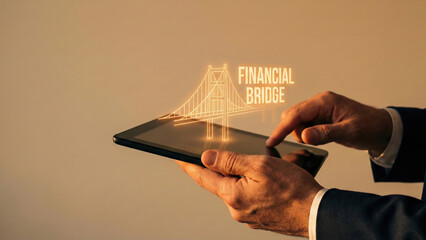Financial bridge high level planning concept glowing above digital tablet in hand symbol for modern financial technology strategy and guidance
