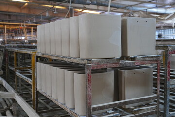 Workers in the bathroom toilet production workshop are working on the production line