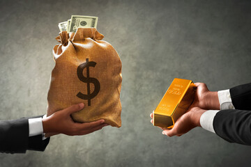 Businessman buying shiny gold bar