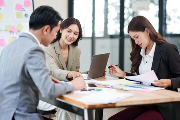 Group of Asian businesspeople are having a business meeting at the office.