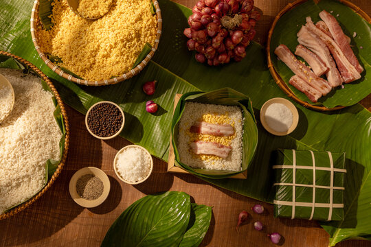 Traditional ingredients for Chung cake arranged on wooden table, representing Lunar New Year food customs and festive cooking traditions shared across Asian cultures