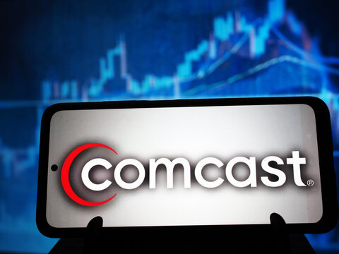 In this photo illustration,  Comcast Corporation logo seen displayed on a smartphone.