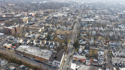 Fototapeta premium Foggy aerial drone photo of Mount Vernon New York with overcast winter sky and dense neighborhoods, image 10