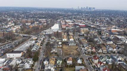 Fototapeta premium Foggy aerial drone photo of Mount Vernon New York with overcast winter sky and dense neighborhoods, image 7