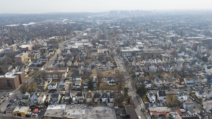 Obraz premium Foggy aerial drone photo of Mount Vernon New York with overcast winter sky and dense neighborhoods, image 15