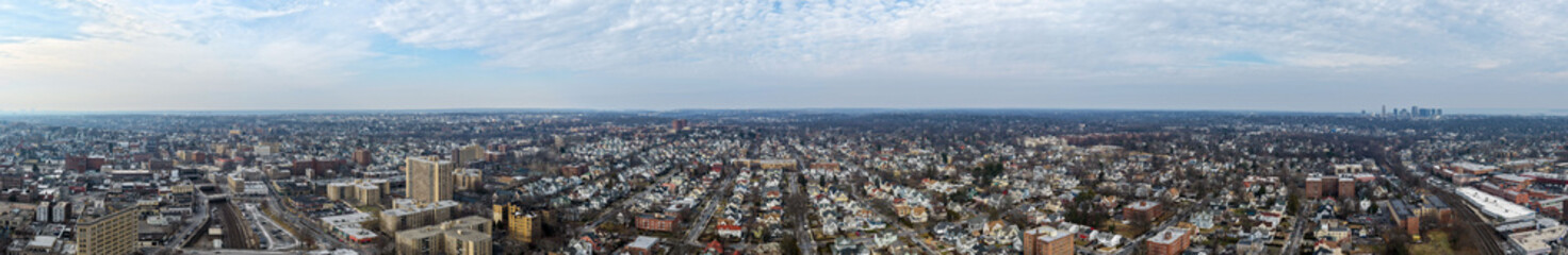 Fototapeta premium Foggy aerial drone photo of Mount Vernon New York with overcast winter sky and dense neighborhoods, image 9