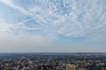 Fototapeta premium Foggy aerial drone photo of Mount Vernon New York with overcast winter sky and dense neighborhoods, image 23