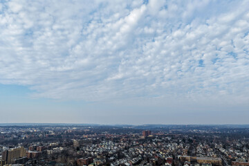 Fototapeta premium Foggy aerial drone photo of Mount Vernon New York with overcast winter sky and dense neighborhoods, image 24