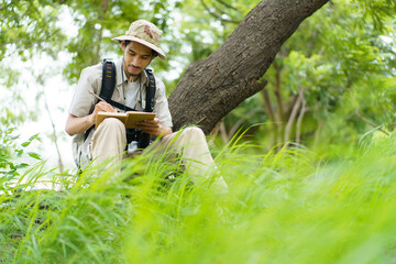 Solo hiker using smartphone outdoors for navigation, travel planning, modern adventure and independence.