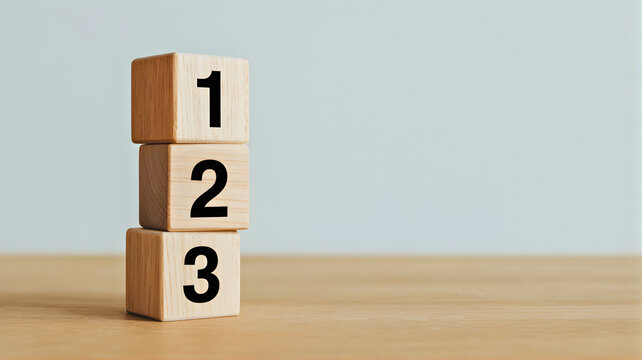 Vertically stacked wooden blocks with numbers 1, 2, and 3, symbolizing a clear progression, sequential steps, or a solid foundation for various plans, processes, and objectives