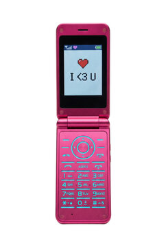 Pink metallic flip phone with pixel heart screen. Retro mobile technology.